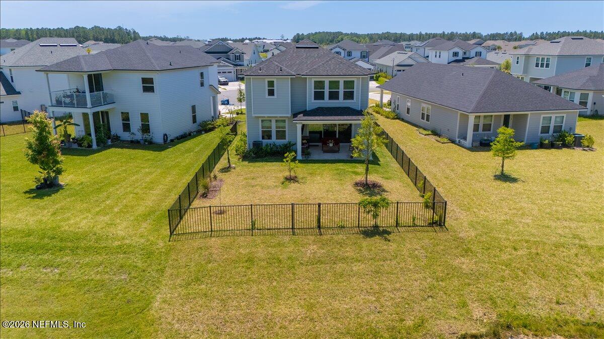 223 Tanner Trail St. Augustine, FL 32092 - Photo 40 of 44 a view of a swimming pool with couches chairs and potted plants