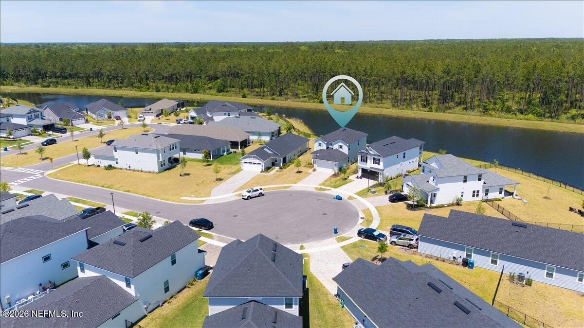 223 Tanner Trail St. Augustine, FL 32092 - Photo 42 of 44 an aerial view of a house with outdoor space and lake view