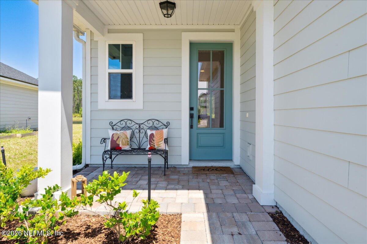 223 Tanner Trail St. Augustine, FL 32092 - Photo 7 of 44 a front view of a house with outdoor seating