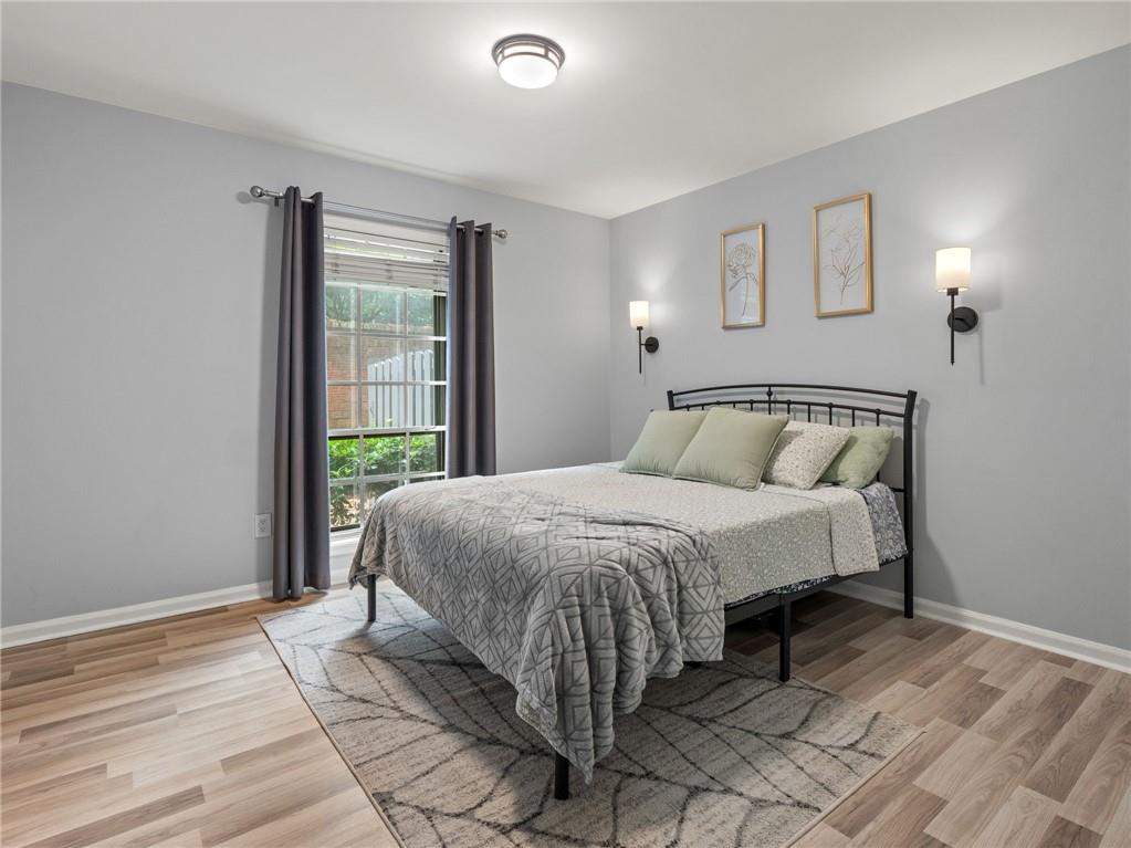 6851 Roswell Road, Unit H26 Atlanta, GA 30328 - Photo 25 of 49 a bedroom with a bed and window