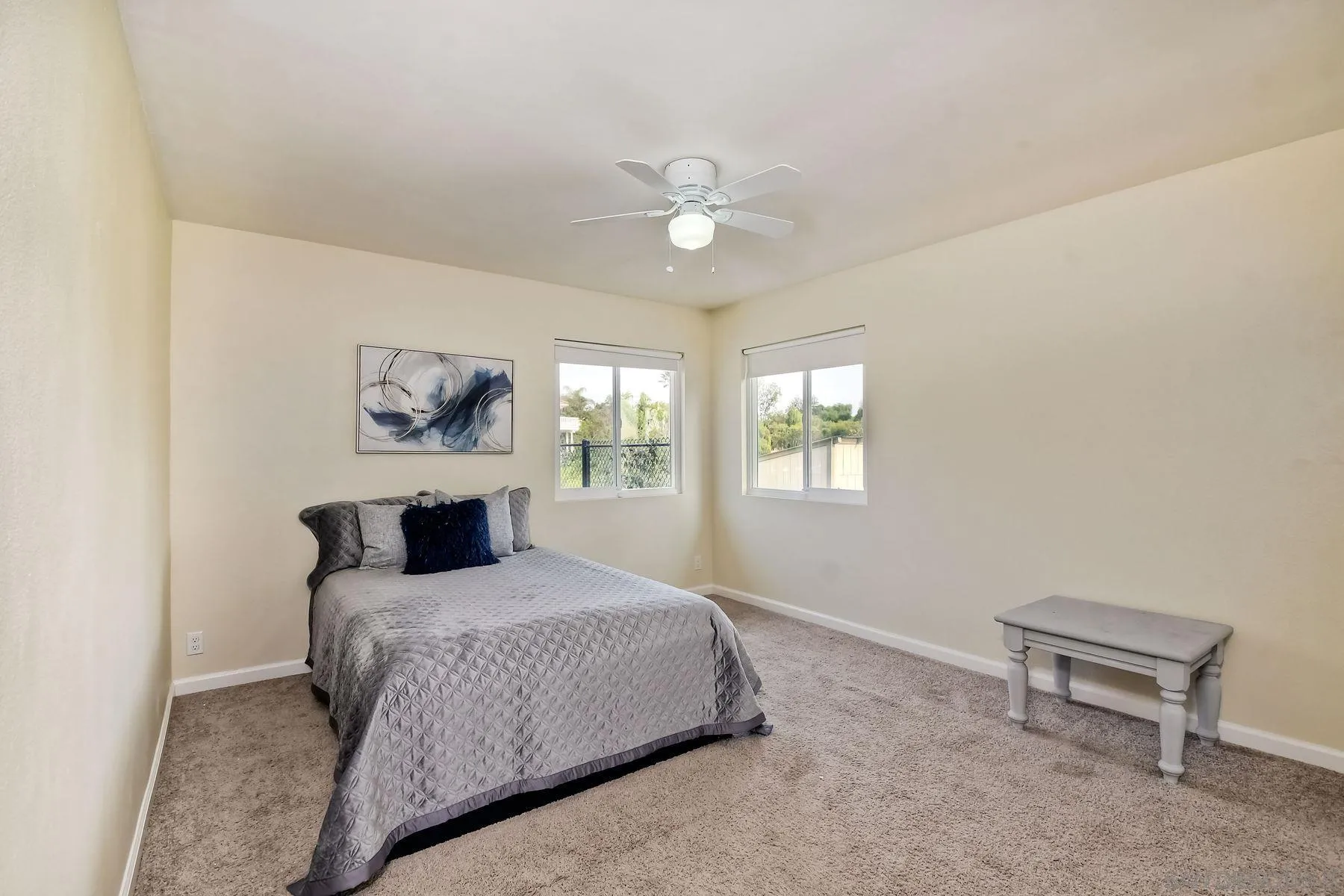 2705 Alexander Drive Escondido, CA 92029 - Photo 15 of 60 a bedroom with a bed and a chandelier