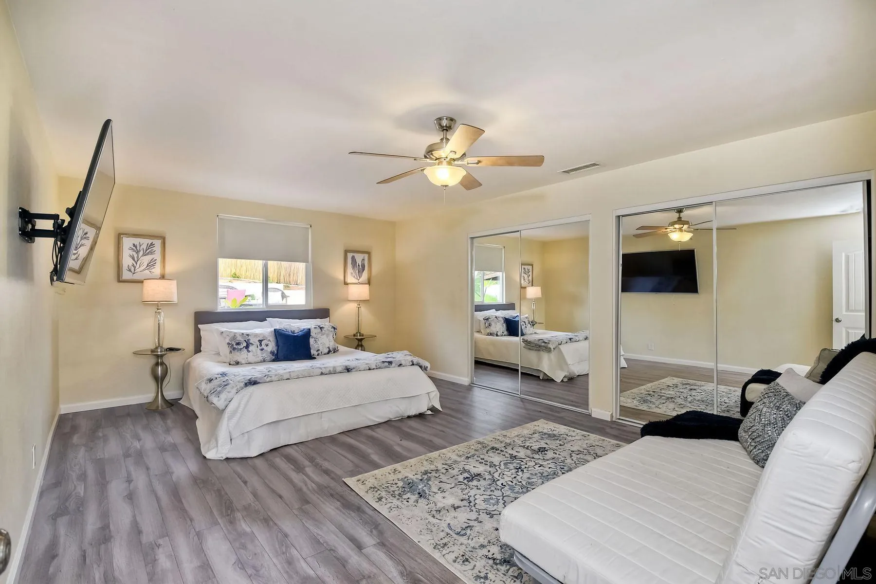 2705 Alexander Drive Escondido, CA 92029 - Photo 20 of 60 a bedroom with a bed wooden floor and window
