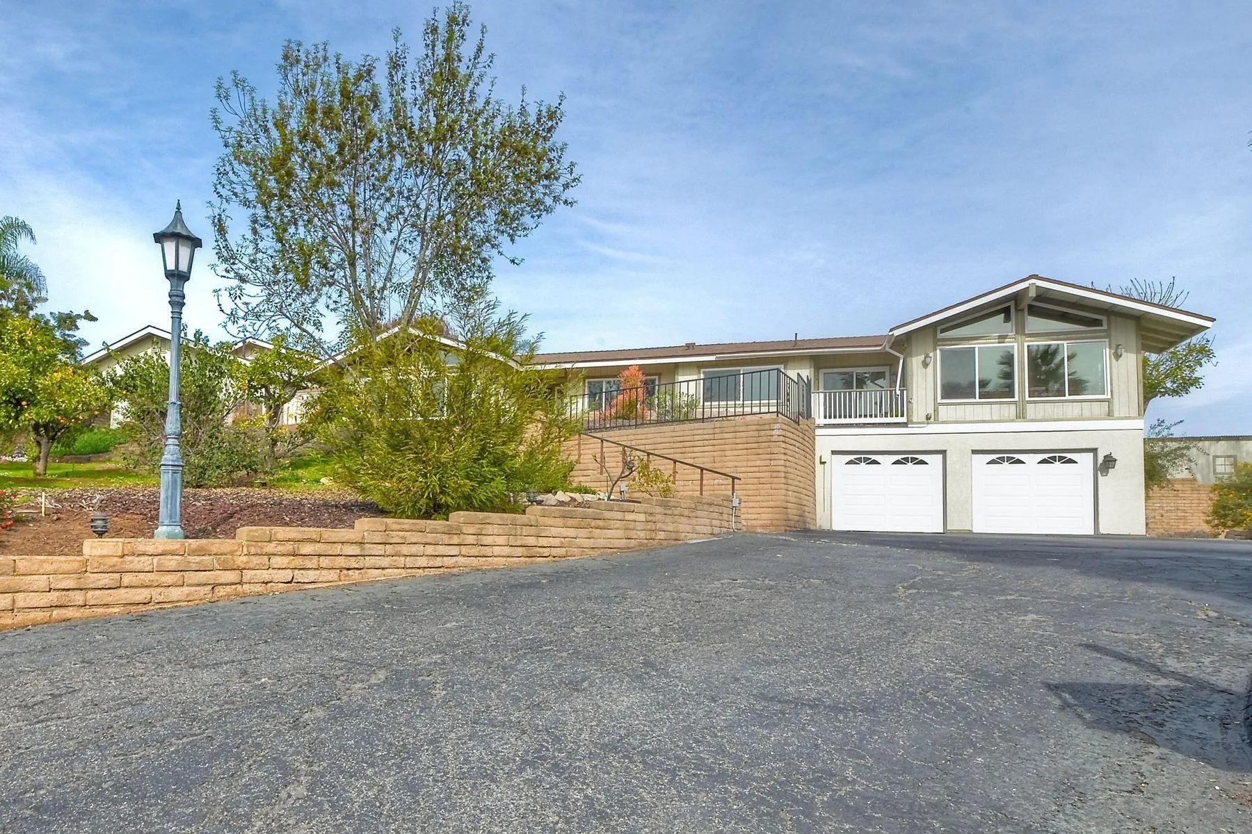 2705 Alexander Drive Escondido, CA 92029 - Photo 2 of 60 a view of a house with a yard and garage
