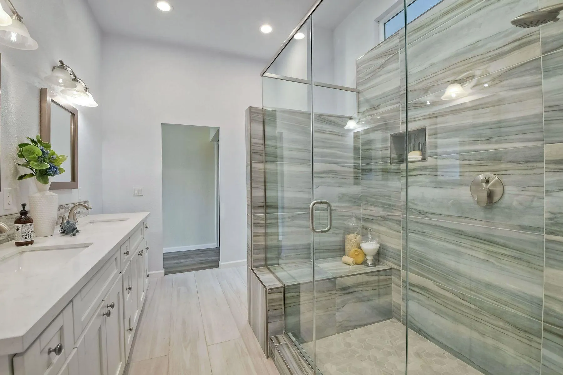 2705 Alexander Drive Escondido, CA 92029 - Photo 25 of 60 a bathroom with a sink and shower