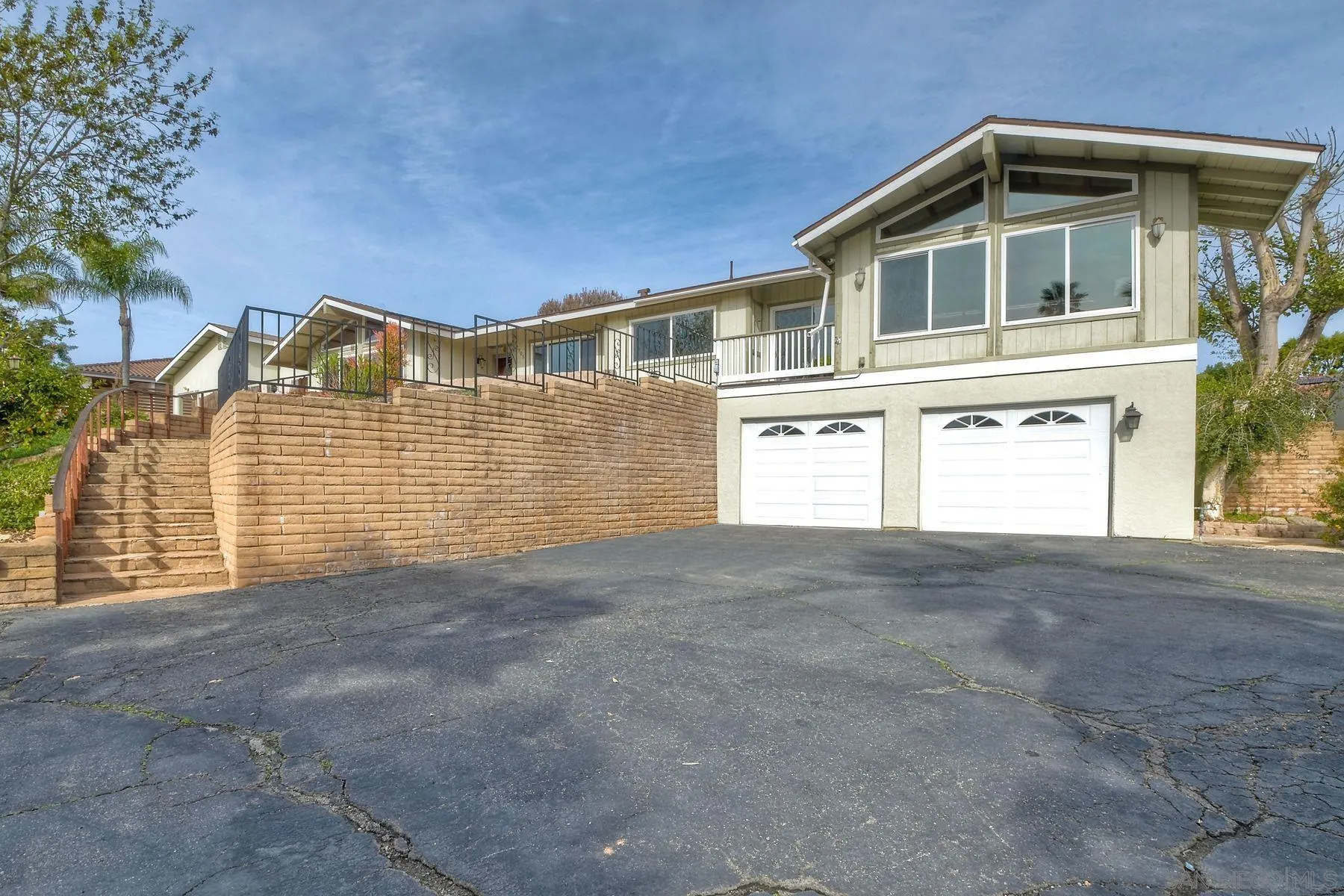 2705 Alexander Drive Escondido, CA 92029 - Photo 3 of 60 a front view of a house with a garage