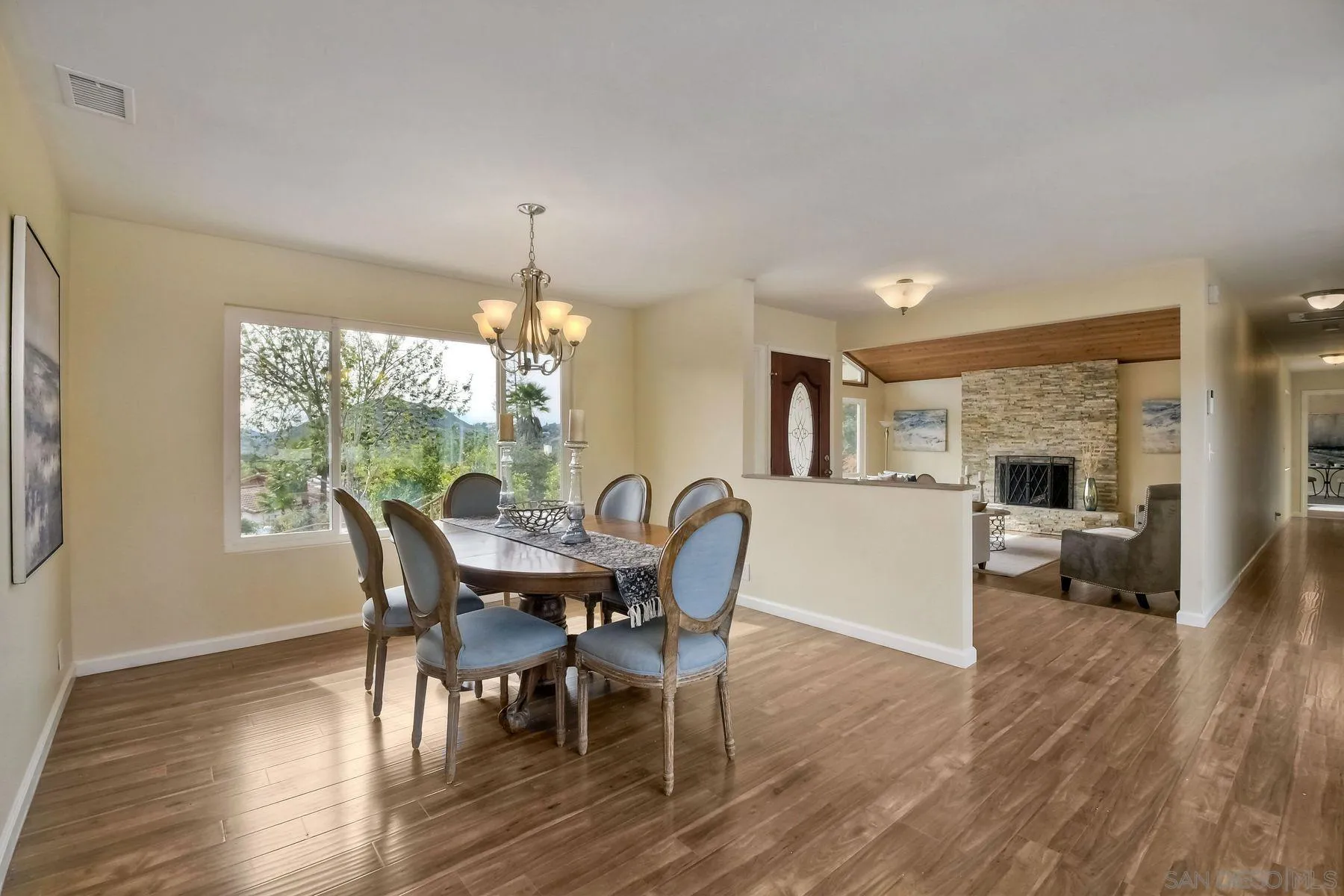 2705 Alexander Drive Escondido, CA 92029 - Photo 8 of 60 a view of a dining room with furniture window and wooden floor