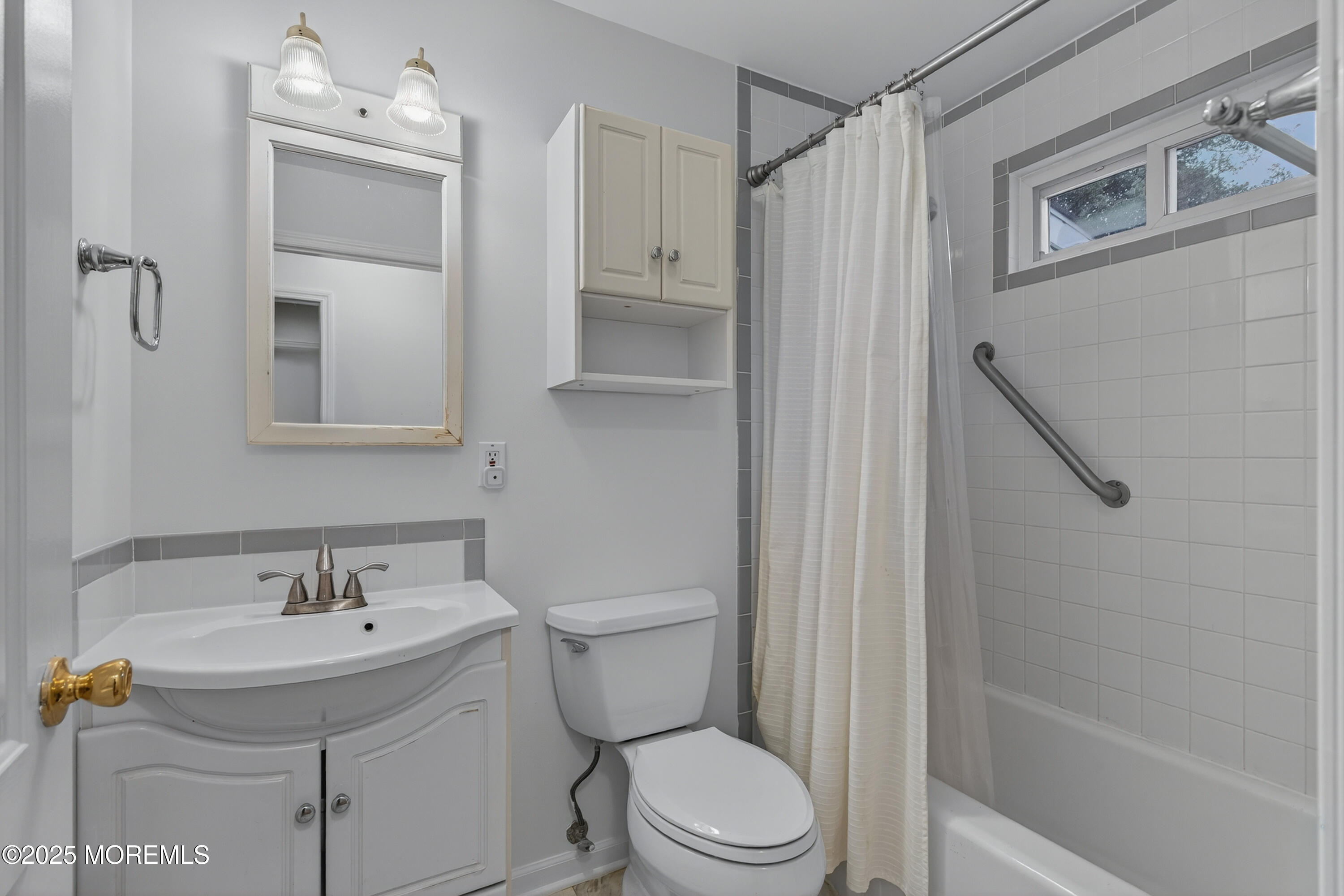 1114 6th Avenue Wall, NJ 07719 - Photo 15 of 21 a bathroom with a sink a toilet and shower