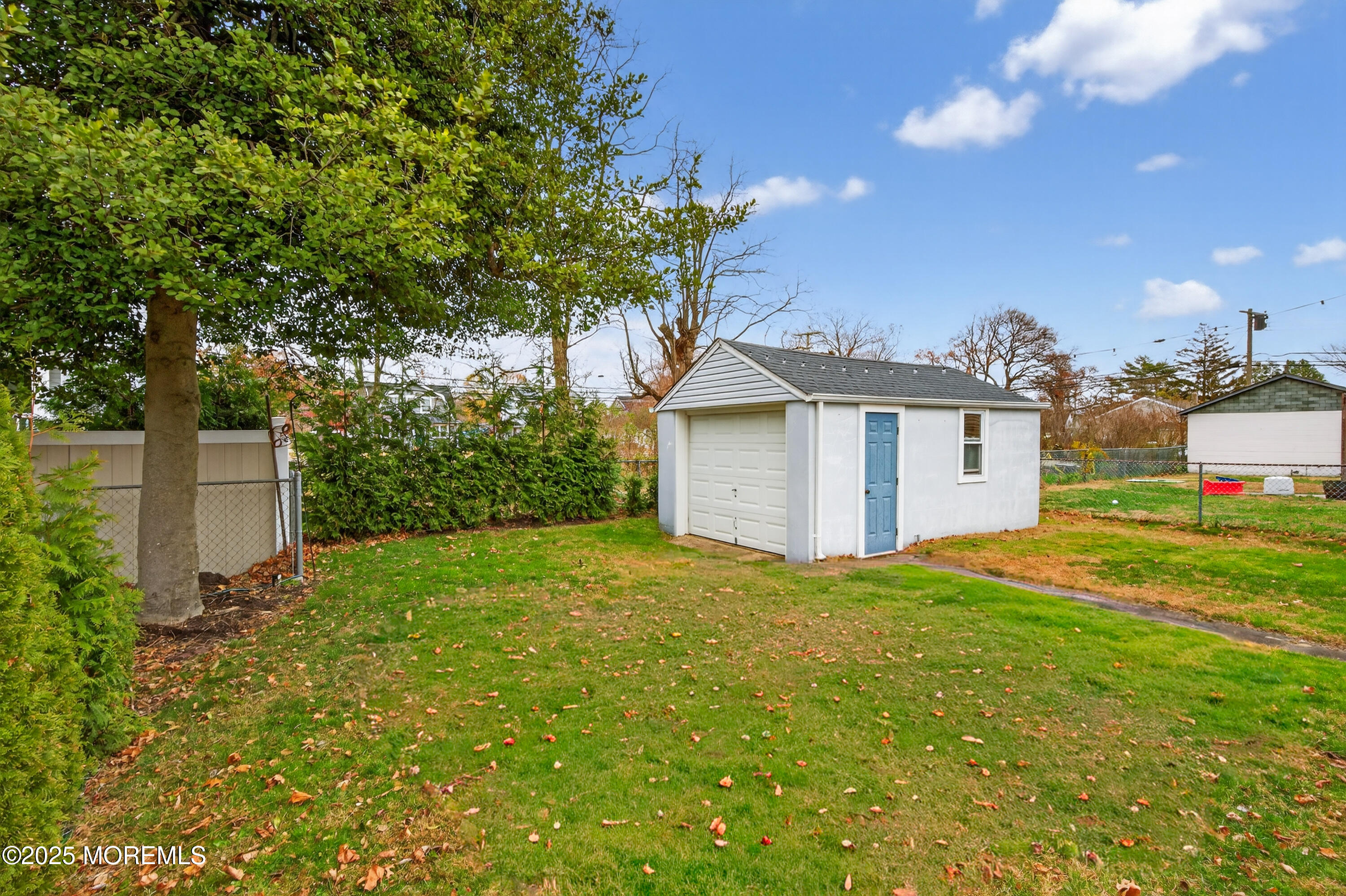 1114 6th Avenue Wall, NJ 07719 - Photo 19 of 21 a view of a house with backyard and garden