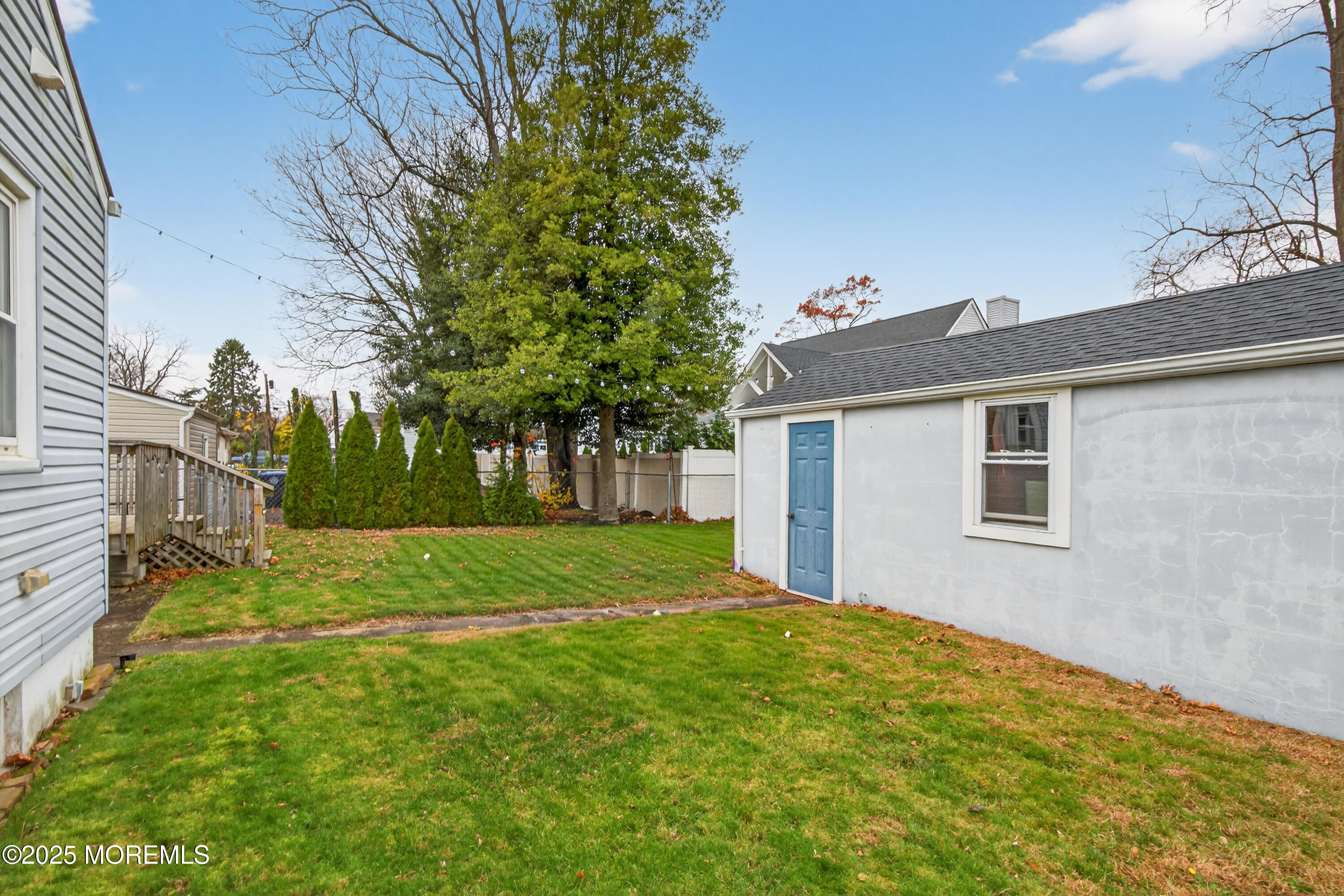 1114 6th Avenue Wall, NJ 07719 - Photo 21 of 21 a view of a backyard with large trees