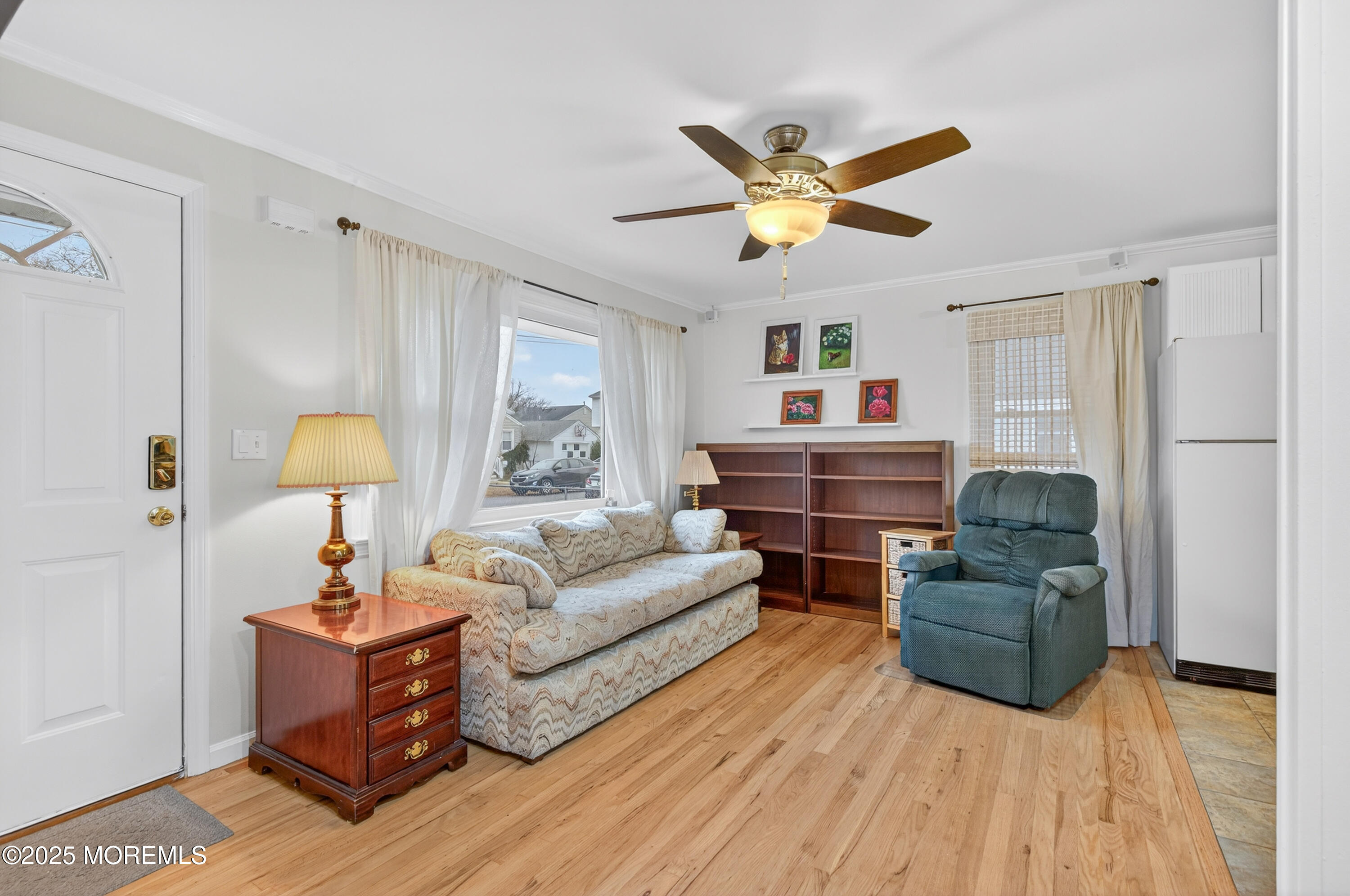 1114 6th Avenue Wall, NJ 07719 - Photo 4 of 21 a living room with furniture and a chandelier