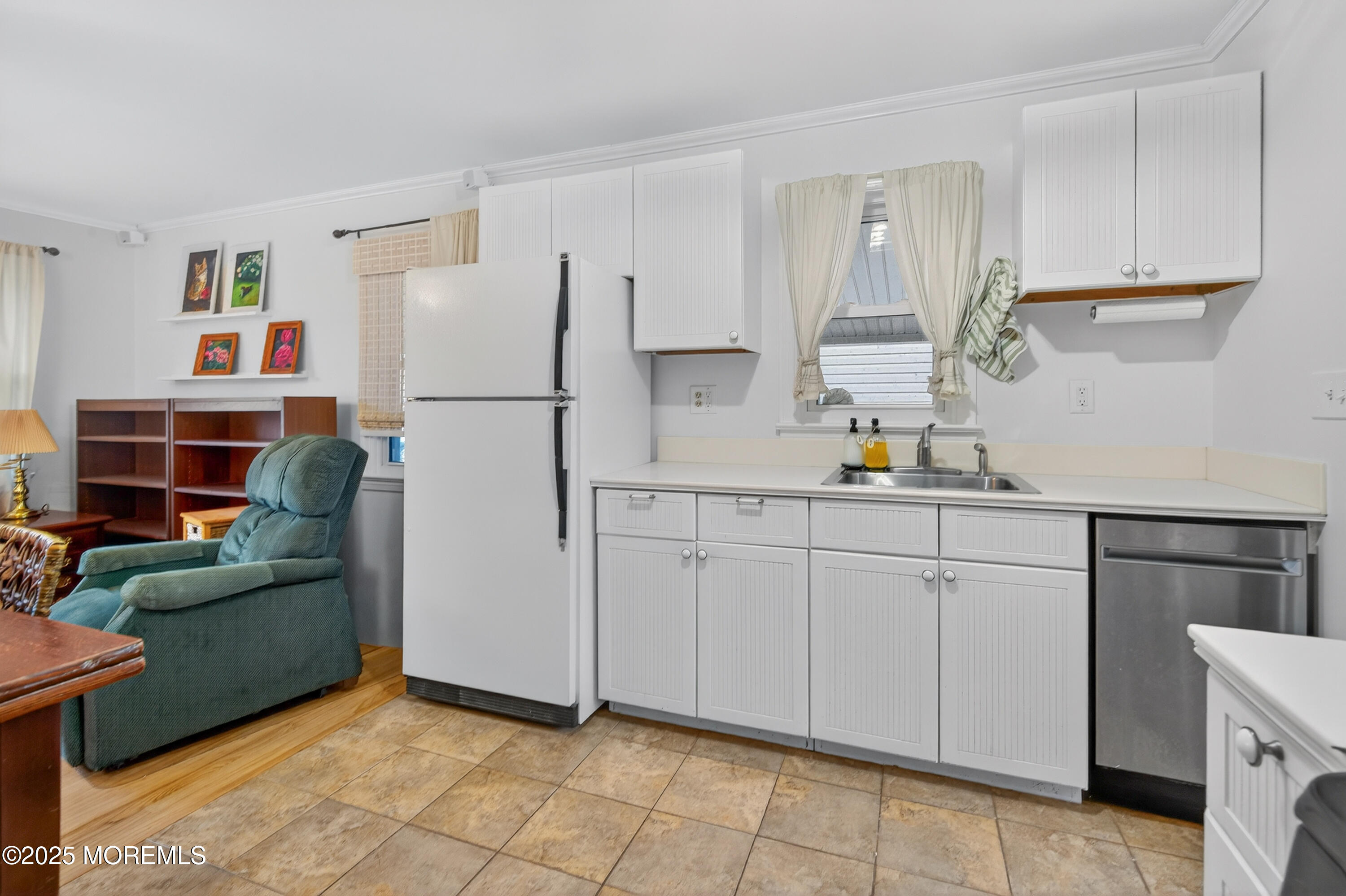 1114 6th Avenue Wall, NJ 07719 - Photo 7 of 21 a kitchen with cabinets and a refrigerator