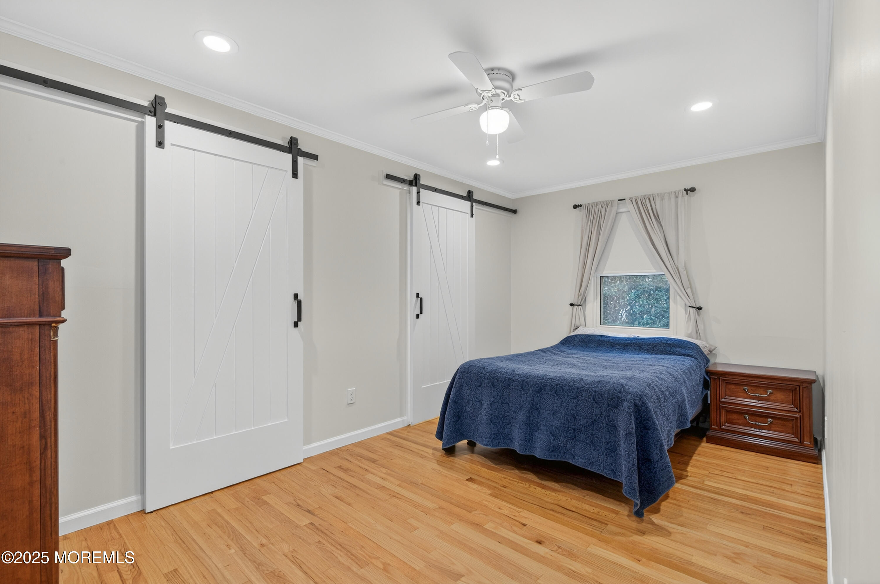 1114 6th Avenue Wall, NJ 07719 - Photo 8 of 21 a bedroom with a bed and a ceiling fan