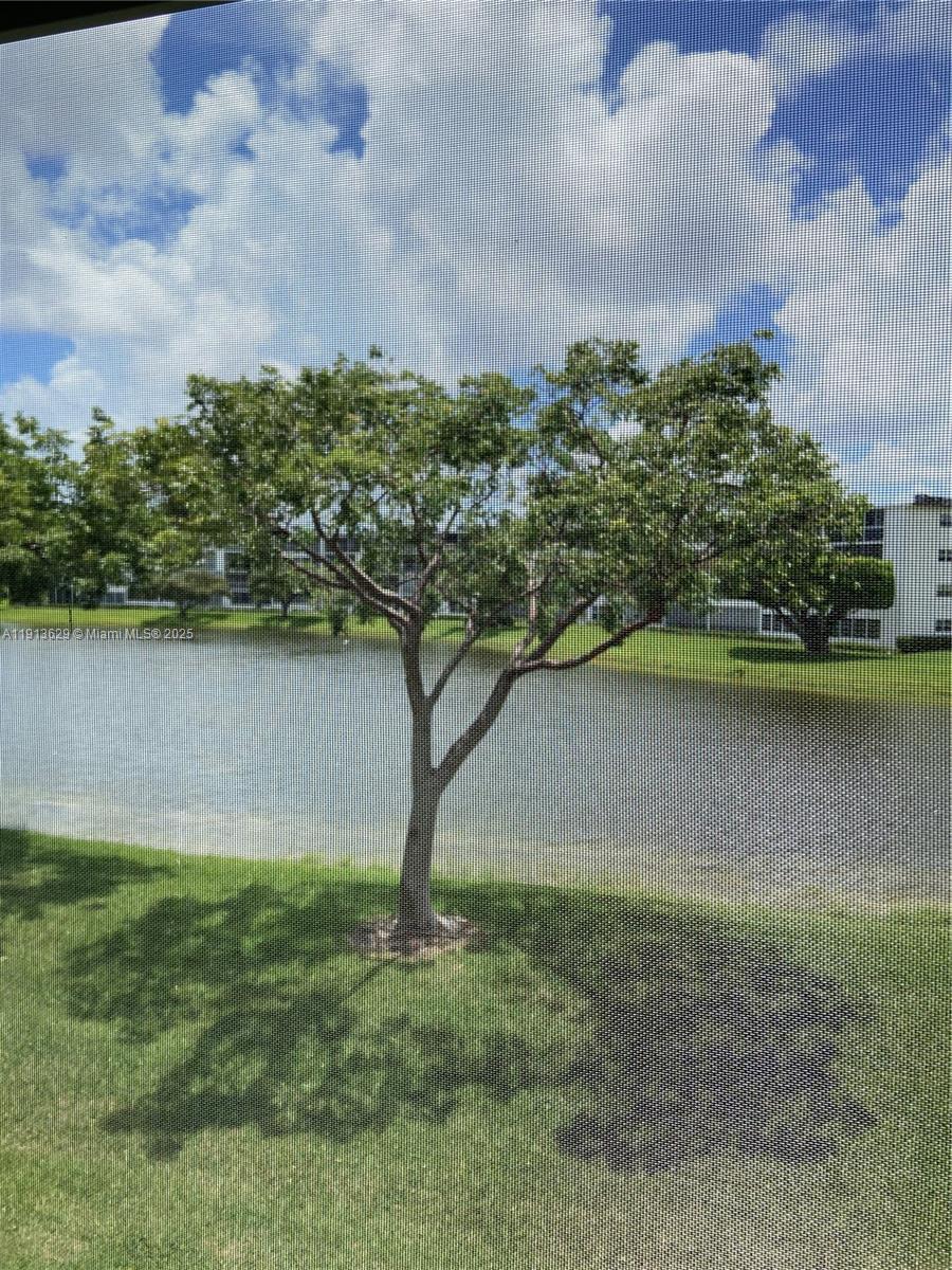 2022 Newcastle B, Unit 2022 Boca Raton, FL 33434 - Photo 18 of 21 a view of a lake with a yard