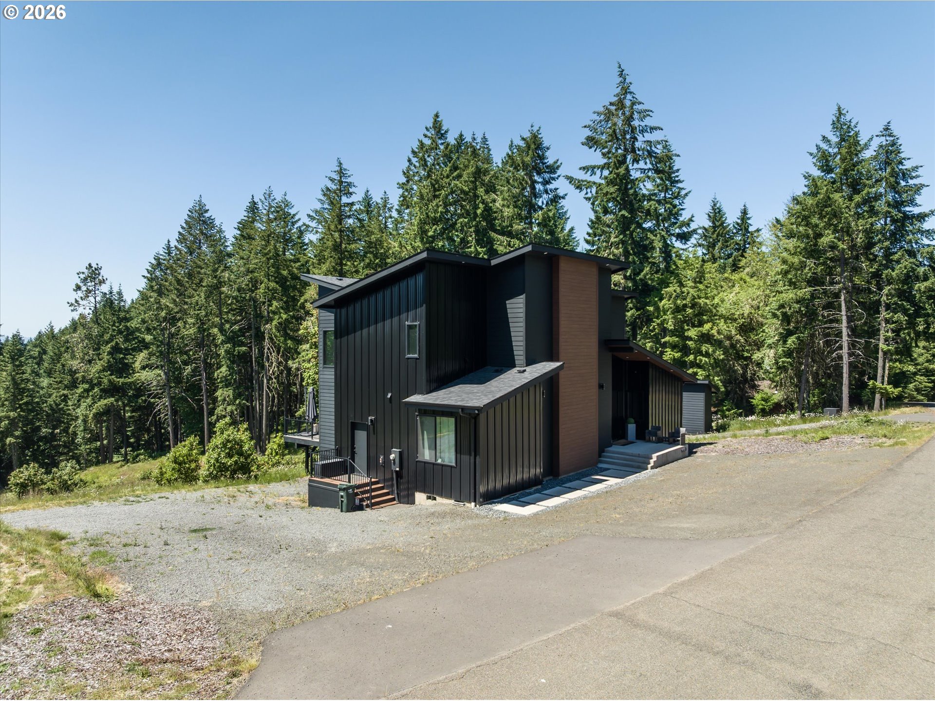 85168 Strayer Place Eugene, OR 97405 - Photo 2 of 33 a front view of a house with a yard and garage