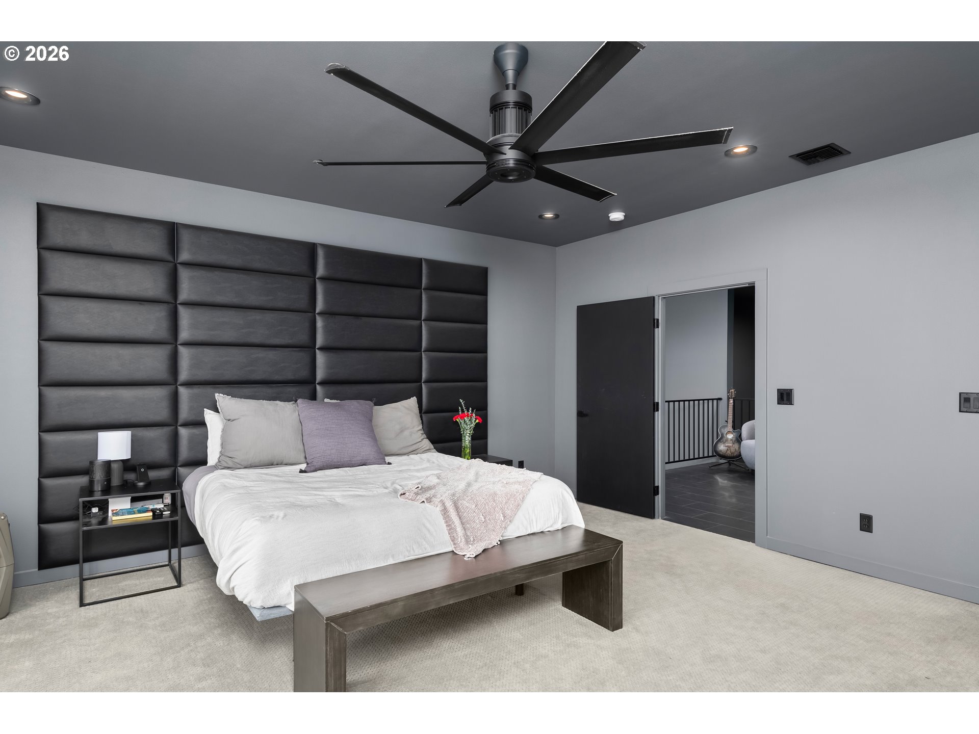 85168 Strayer Place Eugene, OR 97405 - Photo 27 of 33 a bedroom with a bed and a chandelier