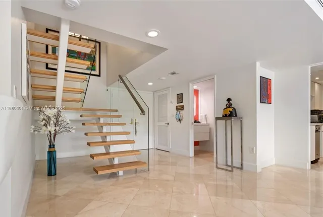 a bedroom with bed and window