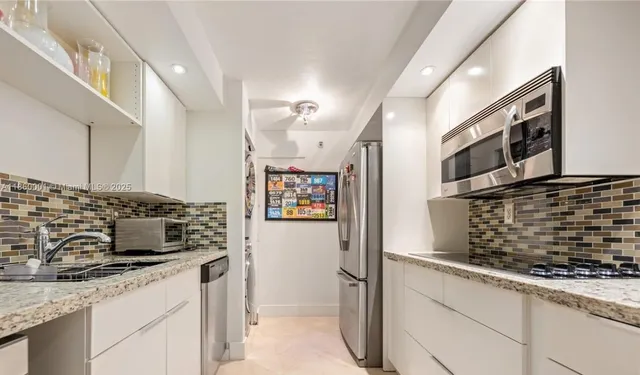 a large bedroom with a bed and window