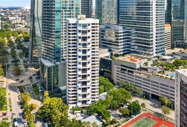 a front view of a building with a yard