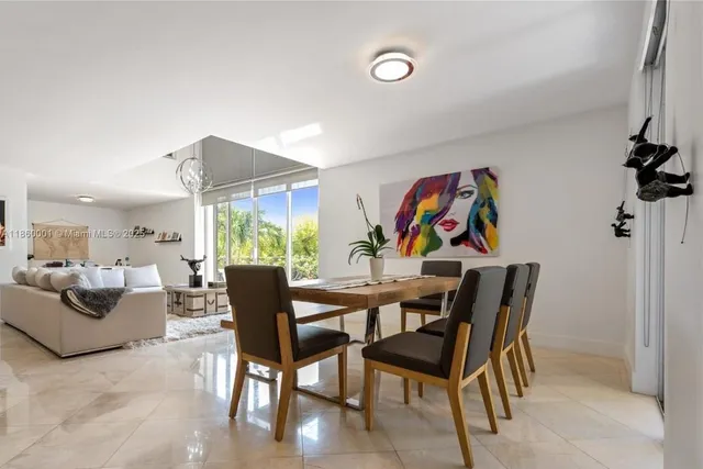 a kitchen with stainless steel appliances kitchen island granite countertop a sink and cabinets