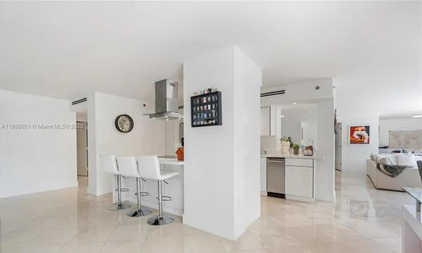 a kitchen with a sink appliances and cabinets