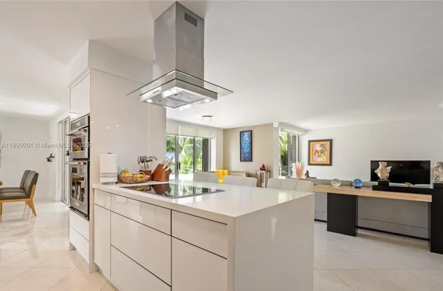 a kitchen with stainless steel appliances a refrigerator and a sink
