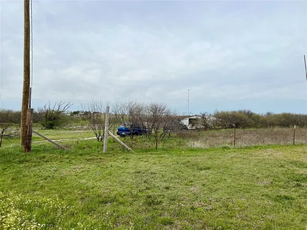 a view of a lake with a big yard
