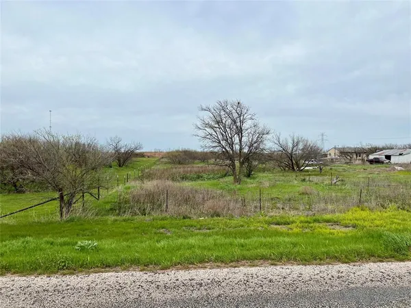 a view of lake with green space