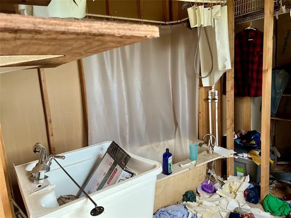 a bathroom with a bathtub and a sink