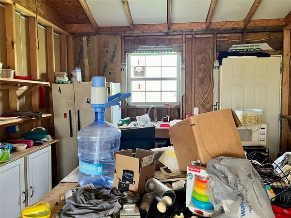 a bed room with furniture and a window