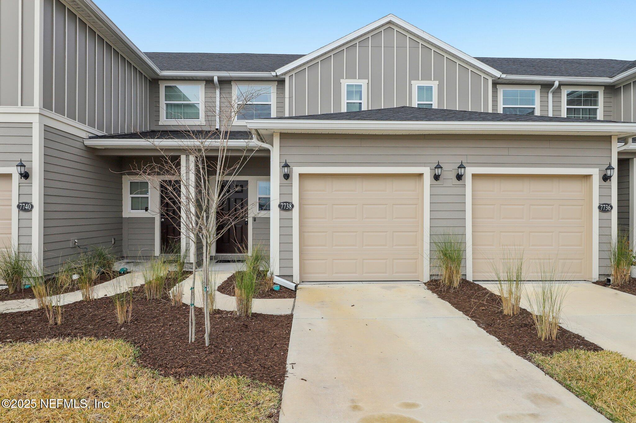 7738 Merchants Way Jacksonville, FL 32222 - Photo 2 of 29 a front view of a house with garden