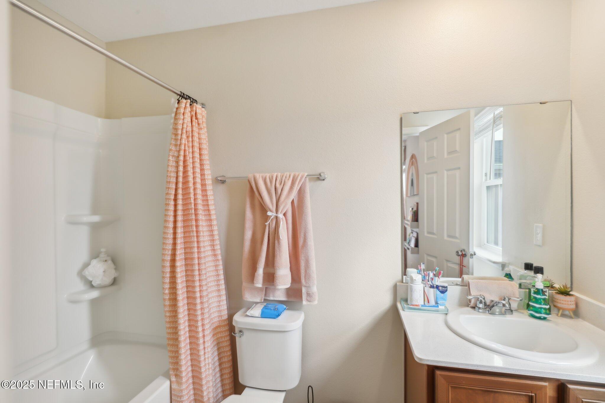 7738 Merchants Way Jacksonville, FL 32222 - Photo 21 of 29 a bathroom with a sink toilet and shower