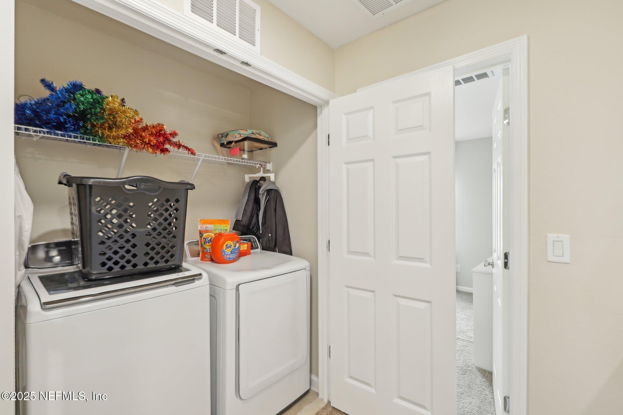7738 Merchants Way Jacksonville, FL 32222 - Photo 23 of 29 a utility room with dryer and washer