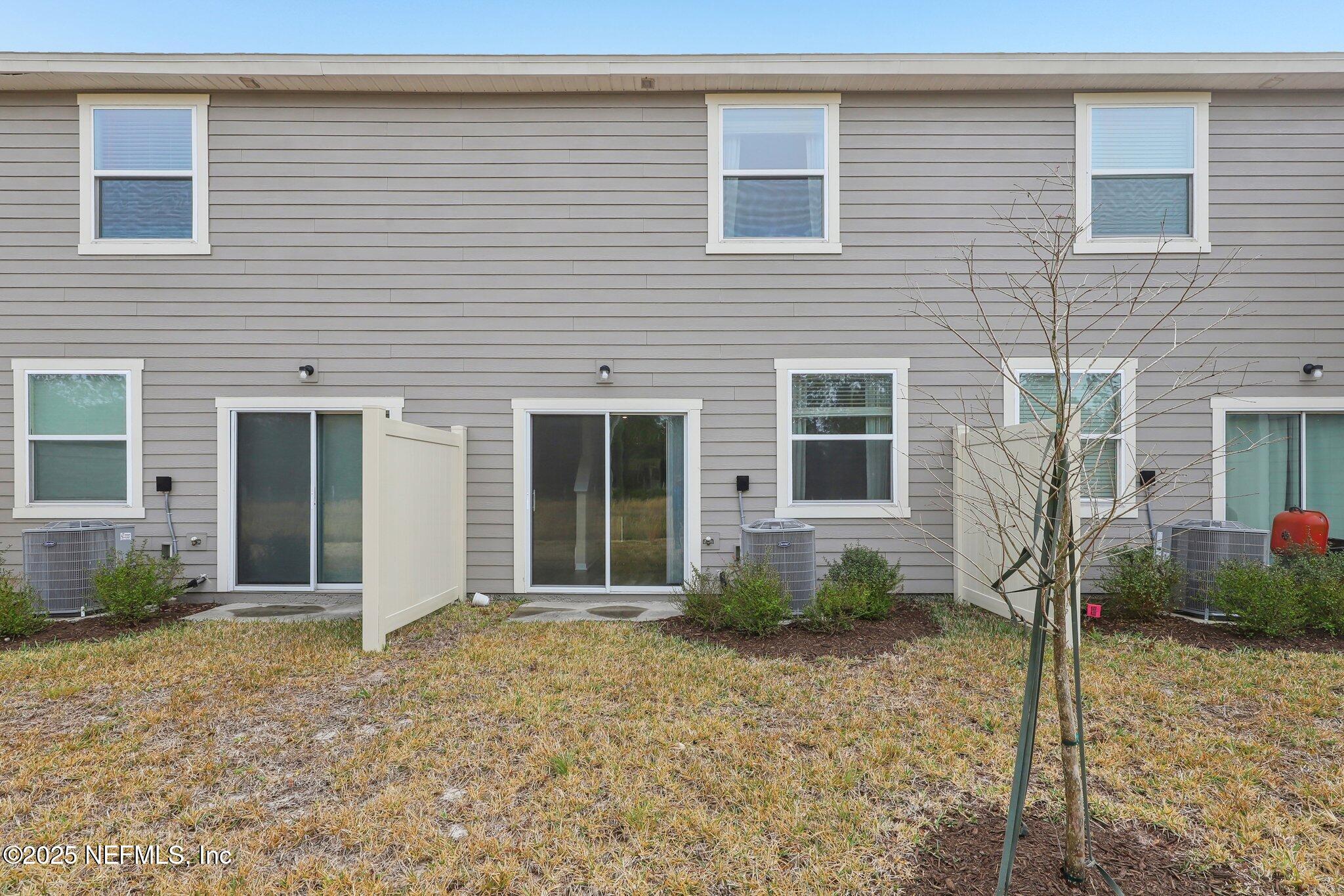 7738 Merchants Way Jacksonville, FL 32222 - Photo 25 of 29 a view of a house with backyard