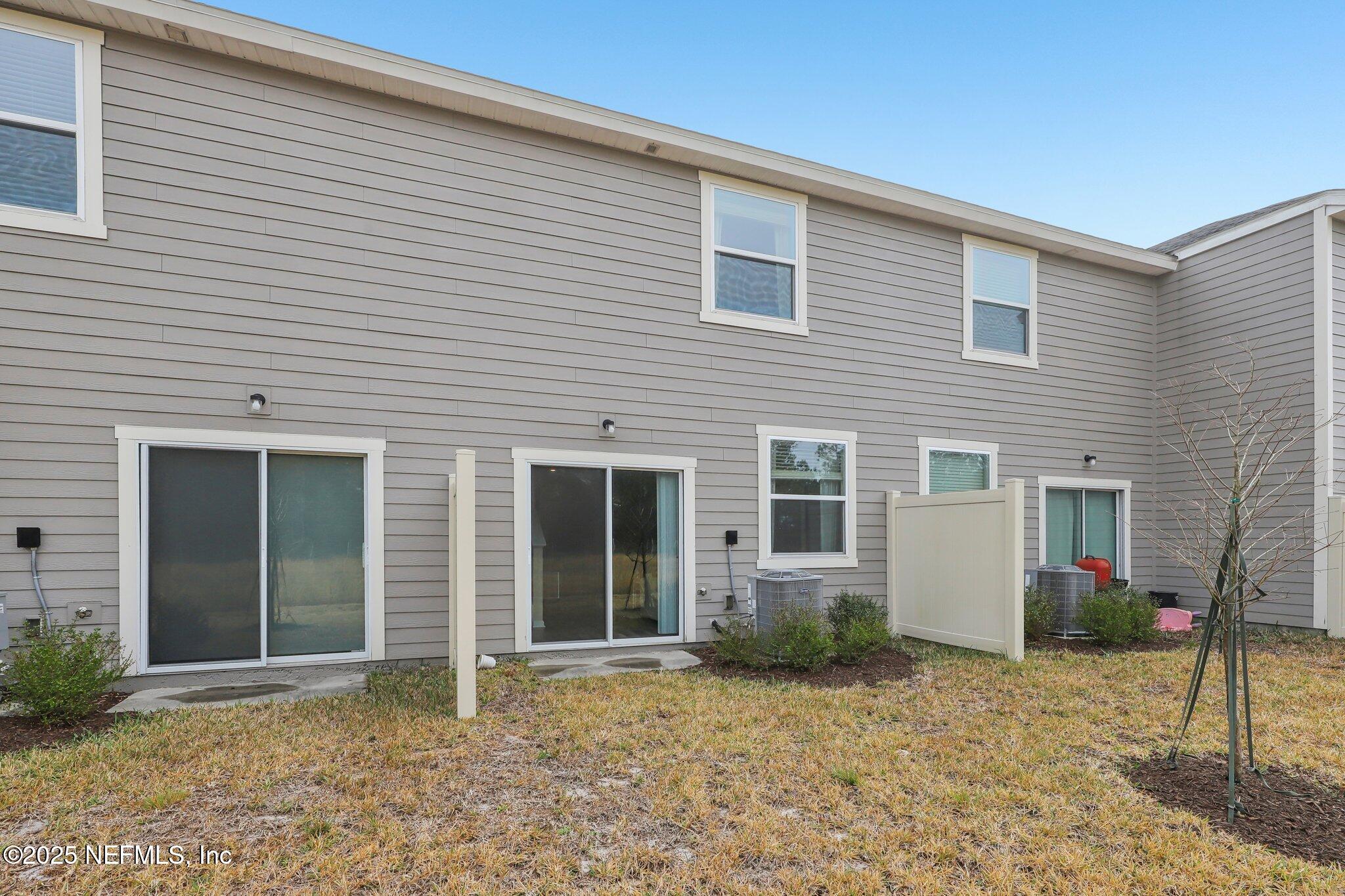 7738 Merchants Way Jacksonville, FL 32222 - Photo 26 of 29 a view of a house with a backyard