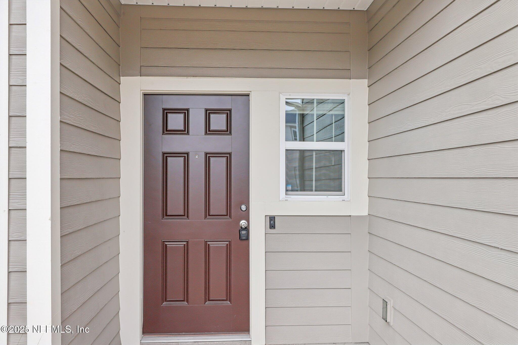 7738 Merchants Way Jacksonville, FL 32222 - Photo 5 of 29 a view of front door of house