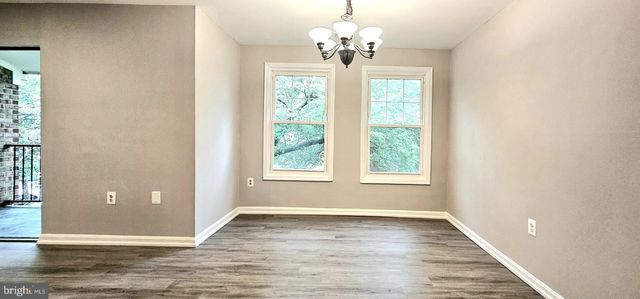 a kitchen with a stove refrigerator and microwave