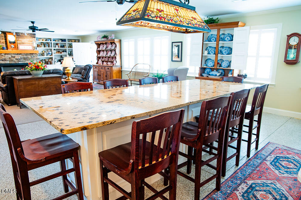 75 Frank Timberlake Road Timberlake, NC 27583 - Photo 47 of 93 a dining table with chairs and window