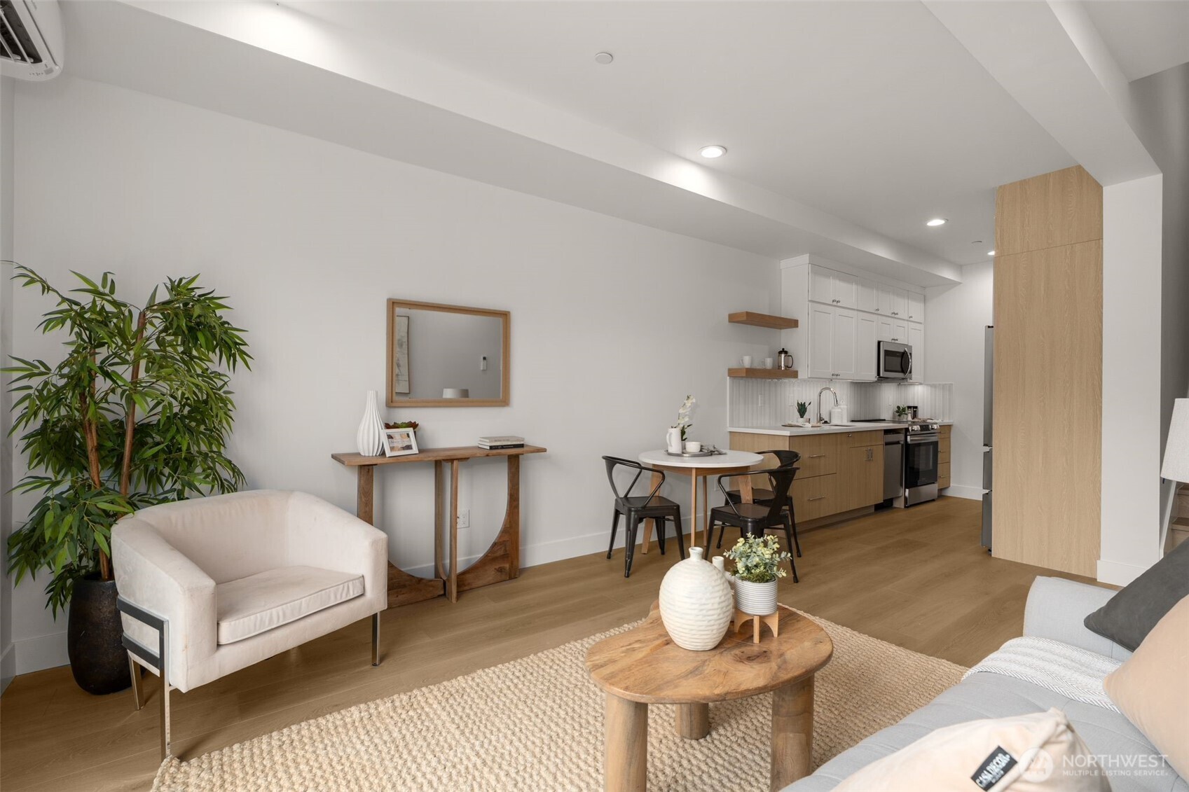 6249 Airport Way South, Unit B Seattle, WA 98108 - Photo 12 of 24 a living room with furniture and a potted plant