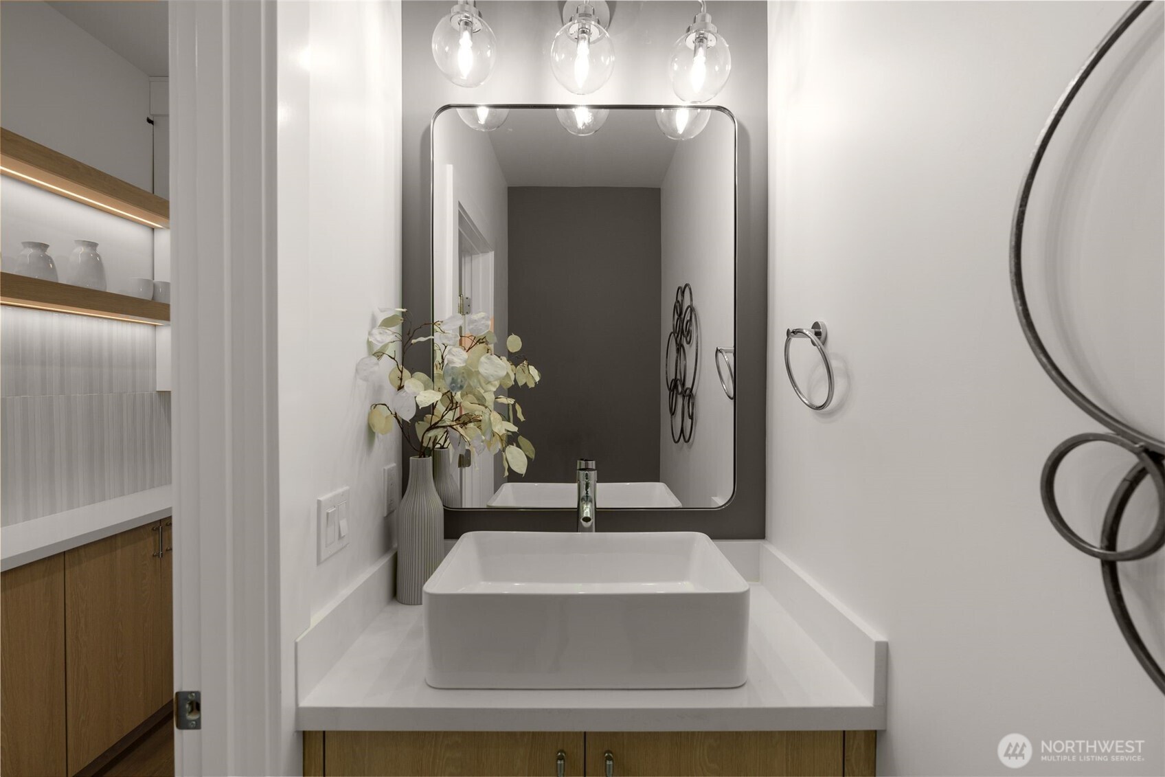 6249 Airport Way South, Unit B Seattle, WA 98108 - Photo 14 of 24 a bathroom with a sink and a mirror