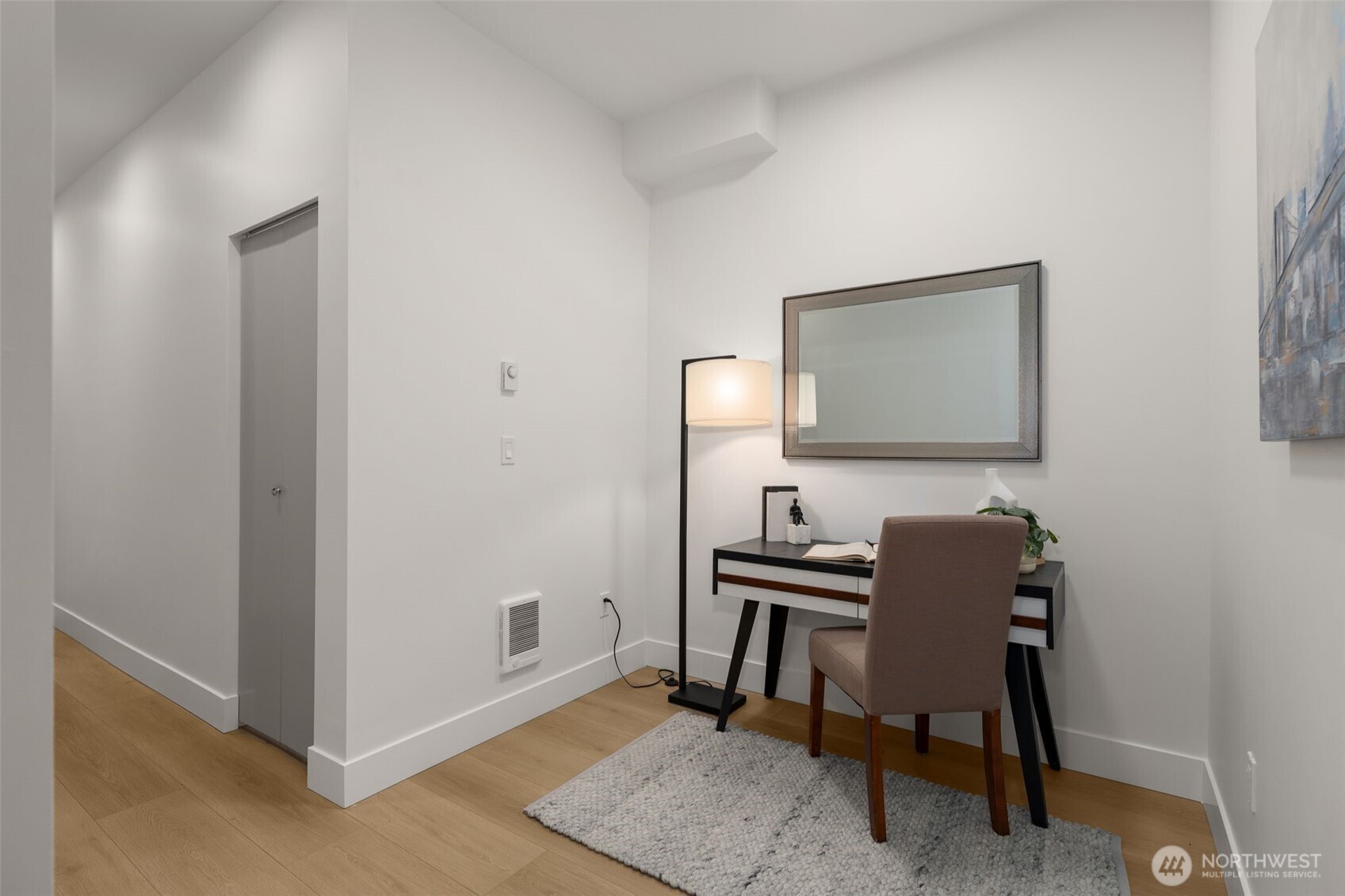 6249 Airport Way South, Unit B Seattle, WA 98108 - Photo 16 of 24 a view of a workspace with furniture and a mirror