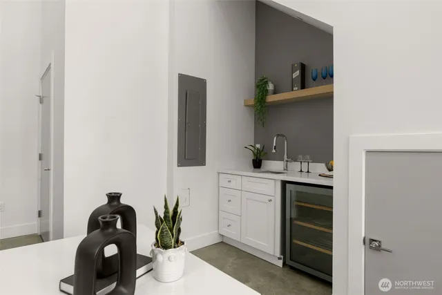 a living room with furniture and potted plant