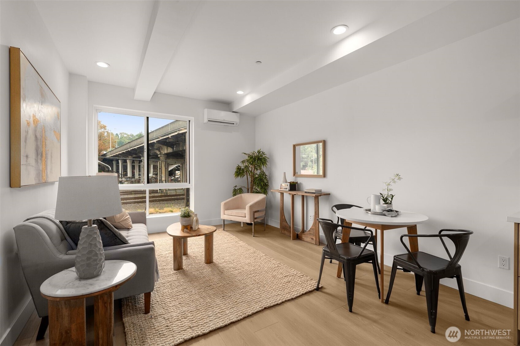 6249 Airport Way South, Unit B Seattle, WA 98108 - Photo 10 of 24 a living room with furniture and a large window