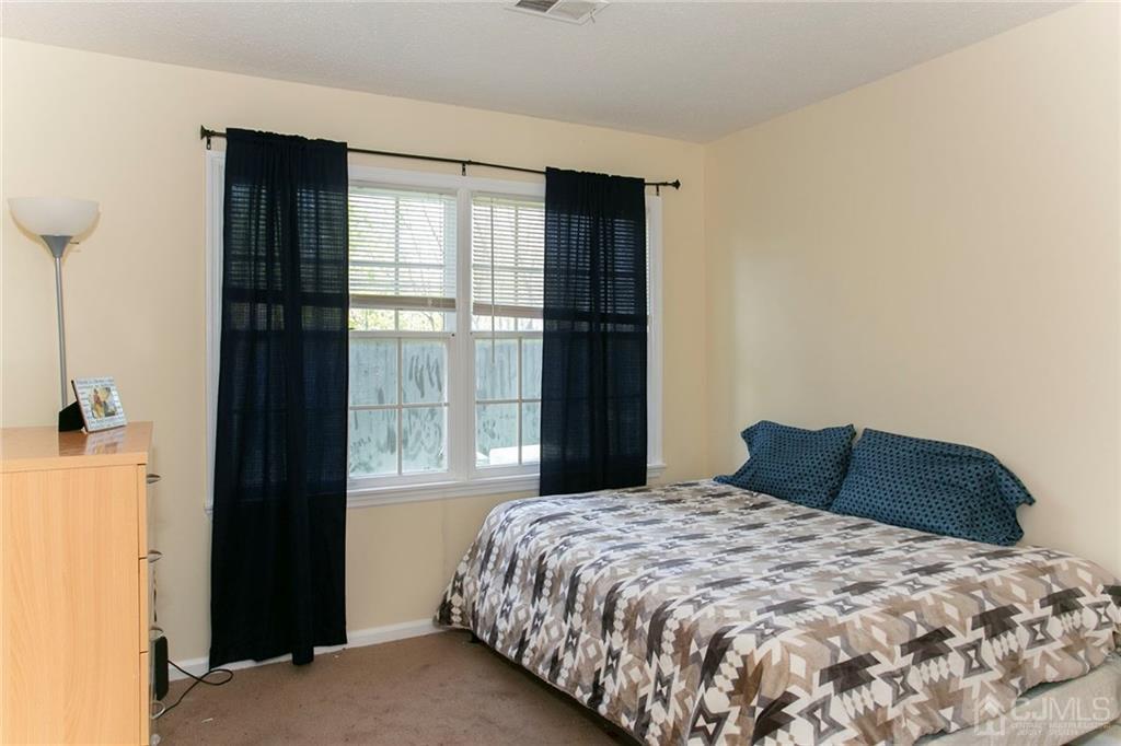 1213 Edpas Road New Brunswick, NJ 08901 - Photo 11 of 14 a bedroom with a bed and a window