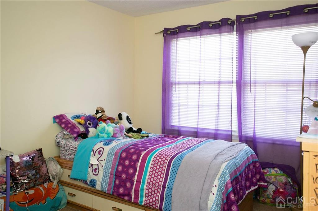 1213 Edpas Road New Brunswick, NJ 08901 - Photo 12 of 14 a bedroom with a bed and a window