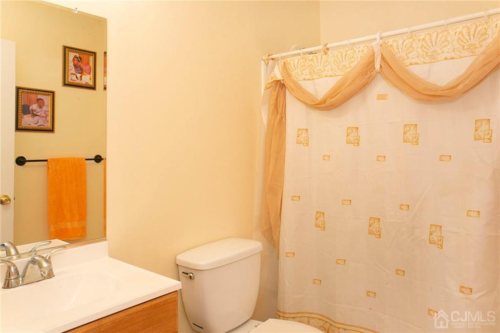 1213 Edpas Road New Brunswick, NJ 08901 - Photo 13 of 14 a bathroom with a sink a toilet and shower