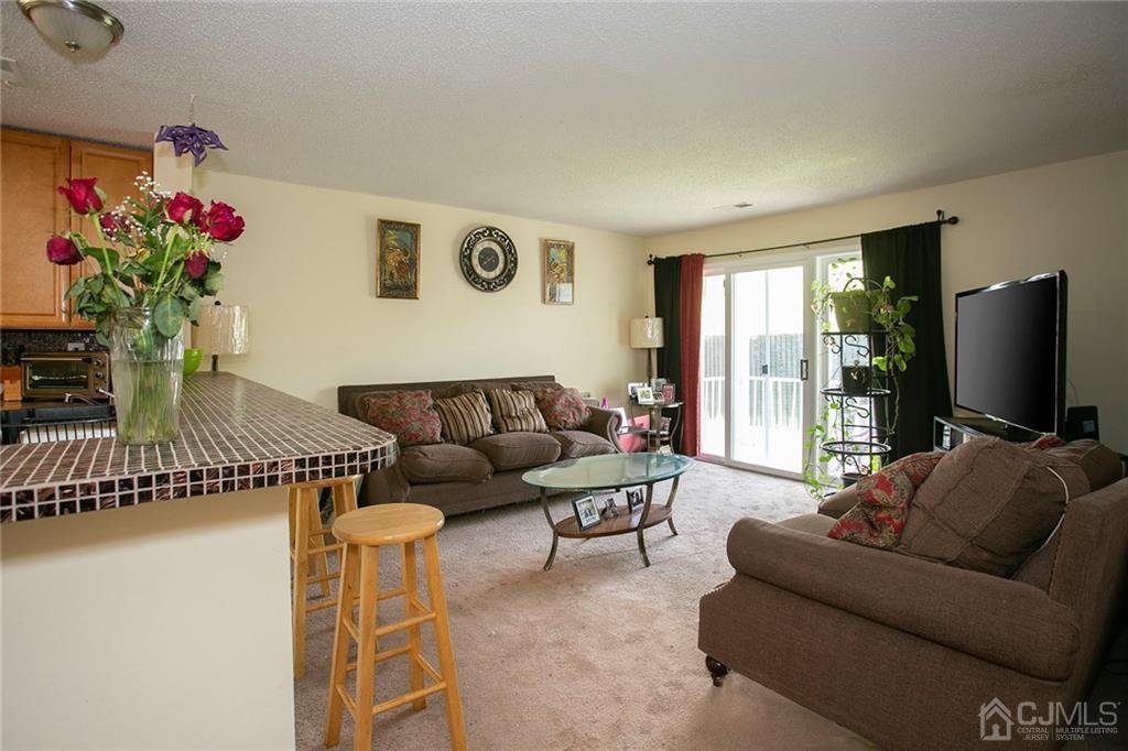 1213 Edpas Road New Brunswick, NJ 08901 - Photo 2 of 14 a living room with furniture and a flat screen tv