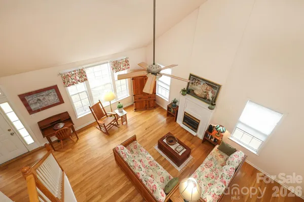 a living room with furniture rug and a flat screen tv