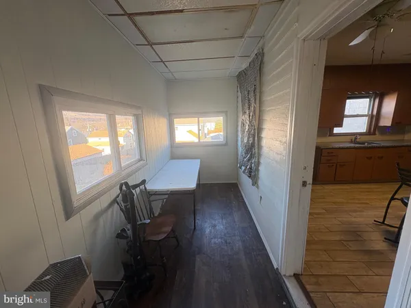 a view of gallery with wooden floor