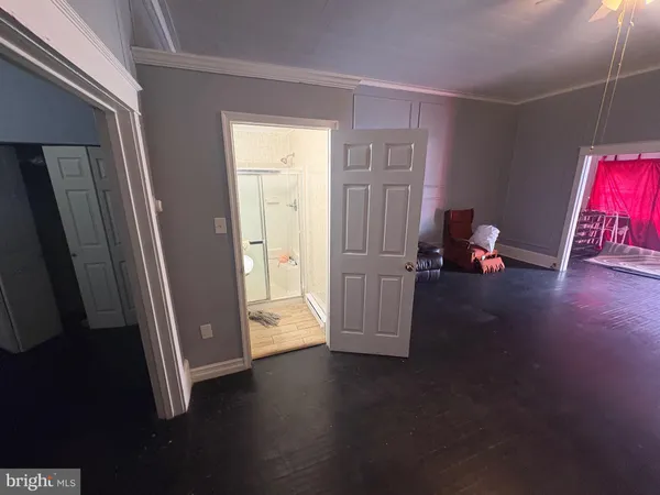 a dining room with furniture and entryway