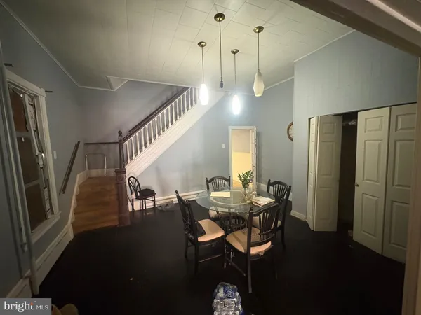 a bathroom with a sink a bath tub and a mirror